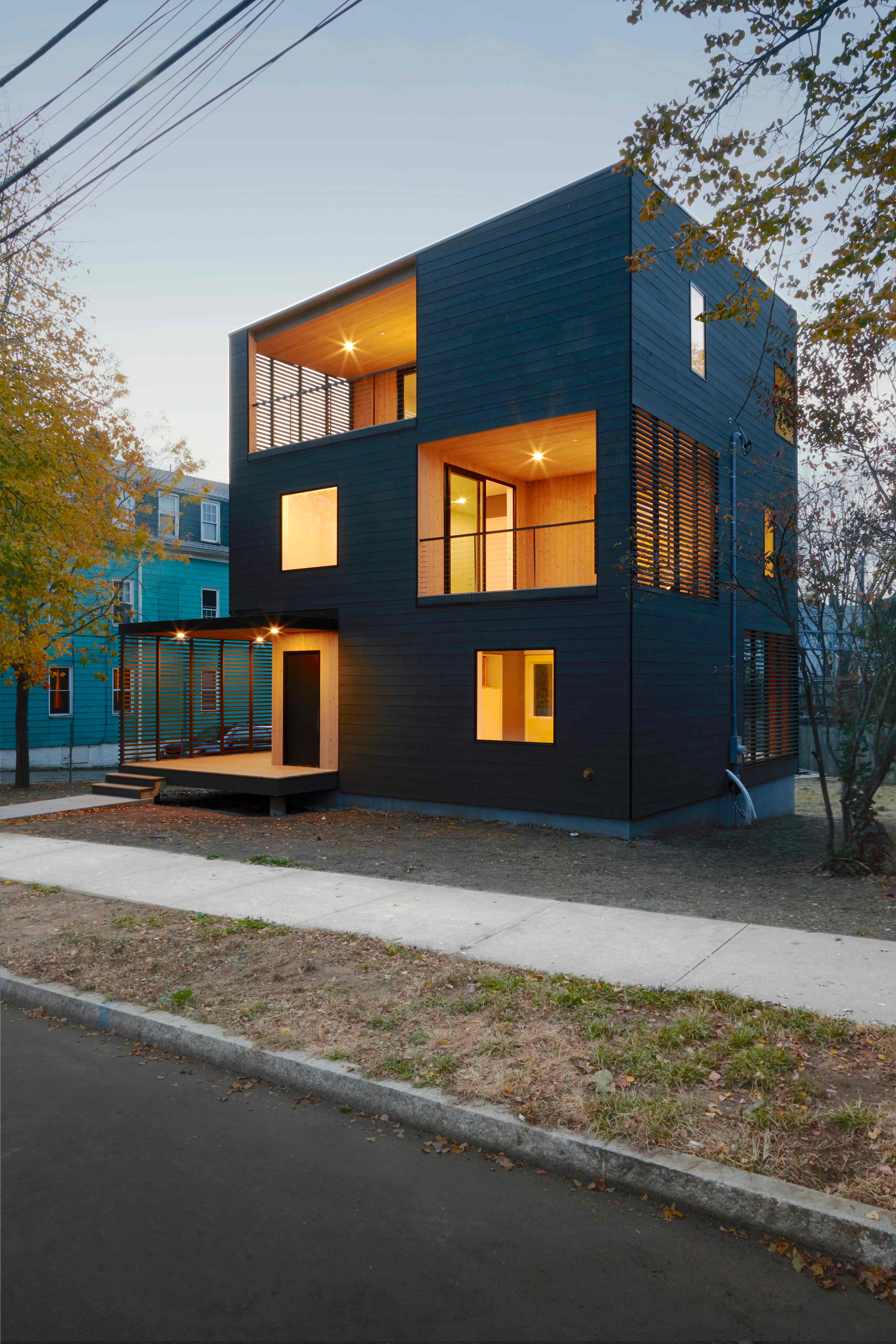 Bright modern interior with hardwood floors, white walls, and large windows